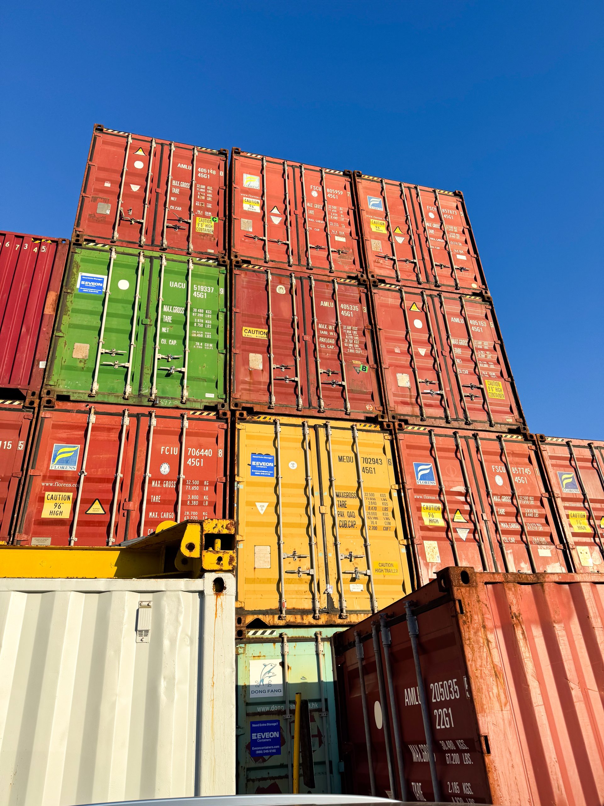 Stacked shipping containers prepared for export through Antillean’s Caribbean shipping network.